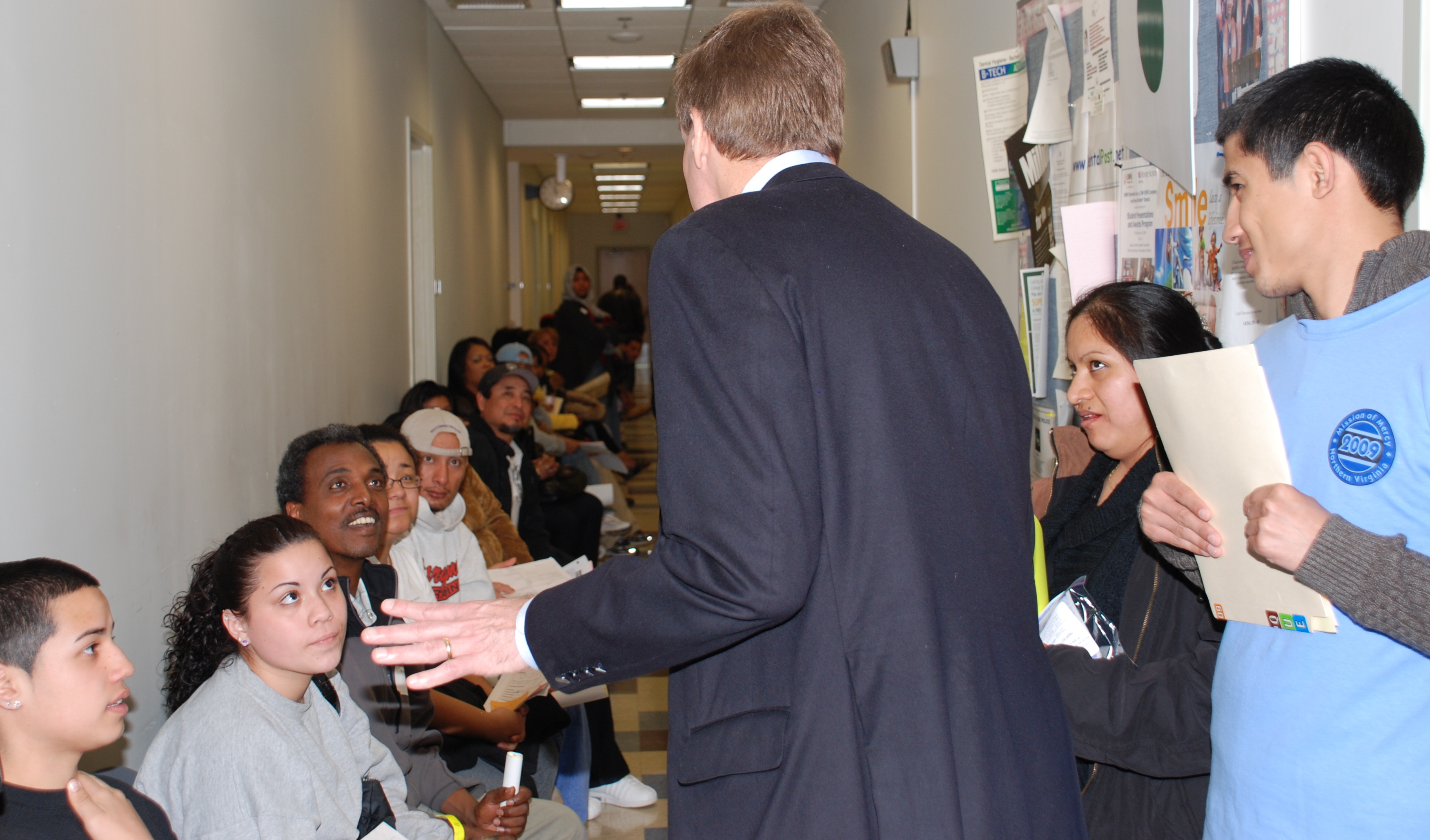 Senator Warner greets patients at the Mission of Mercy's free dental clinic at NVCC's Fairfax Campus